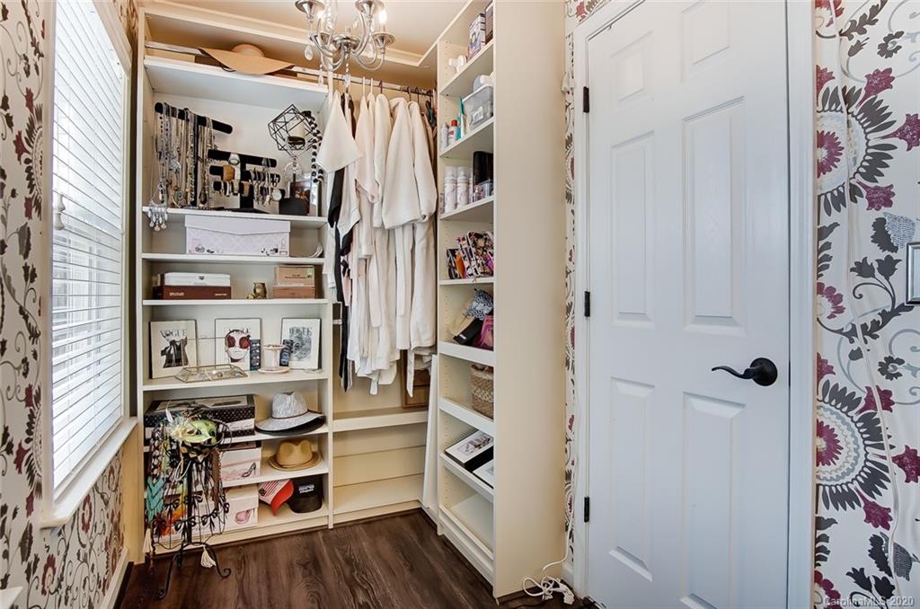 785 Fairway Point Drive Tega Cay, SC 29708 - Photo 26 of 46 a view of walk in closet with clothes and shoes
