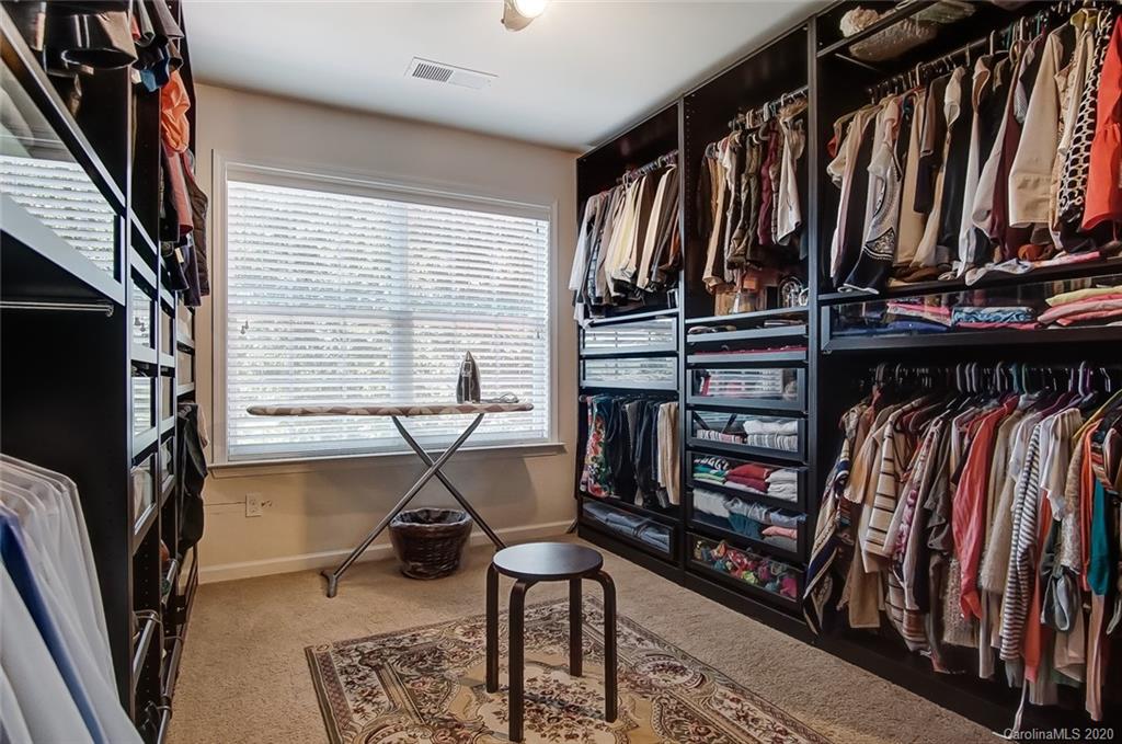 785 Fairway Point Drive Tega Cay, SC 29708 - Photo 27 of 46 a view of walk in closet with clothes and shoes