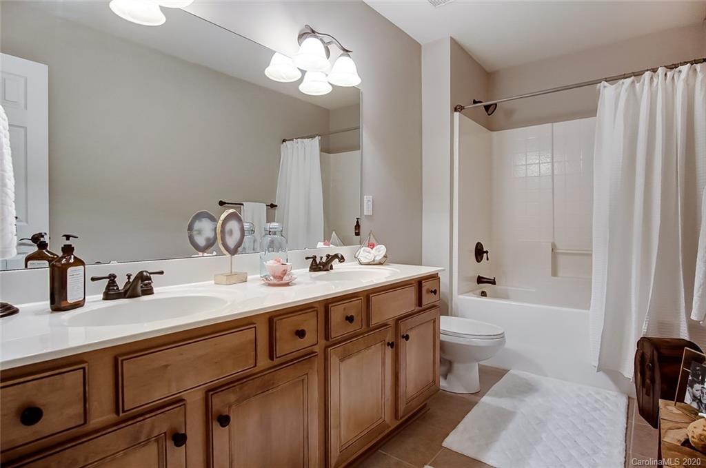 785 Fairway Point Drive Tega Cay, SC 29708 - Photo 29 of 46 a bathroom with a double vanity sink mirror double and toilet