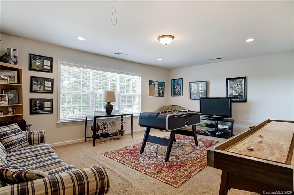 785 Fairway Point Drive Tega Cay, SC 29708 - Photo 31 of 46 a bedroom with furniture and a window