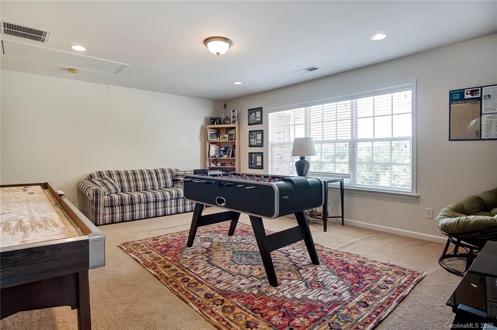 785 Fairway Point Drive Tega Cay, SC 29708 - Photo 32 of 46 a workspace with furniture a rug and a window