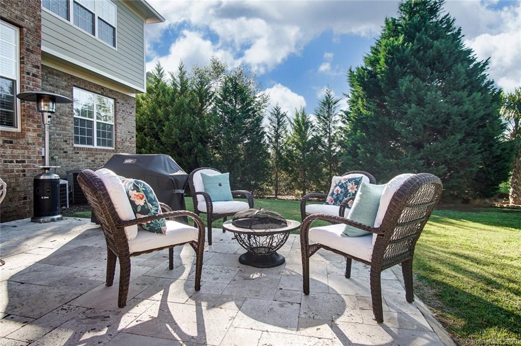 785 Fairway Point Drive Tega Cay, SC 29708 - Photo 37 of 46 a backyard of a house with table and chairs