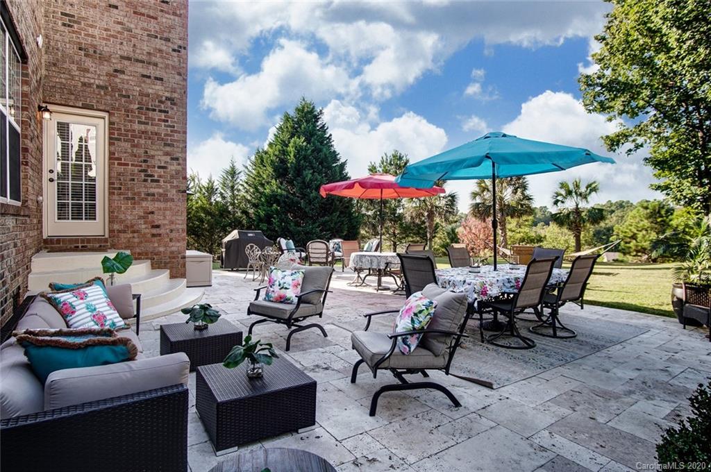 785 Fairway Point Drive Tega Cay, SC 29708 - Photo 39 of 46 a view of a patio with furniture and a table