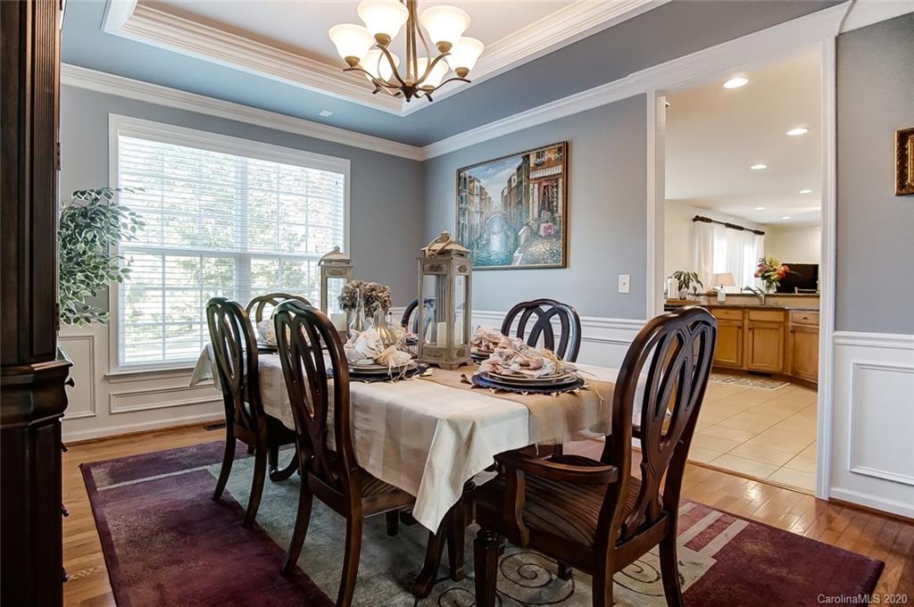 785 Fairway Point Drive Tega Cay, SC 29708 - Photo 5 of 46 a view of a a dining room with furniture window and wooden floor