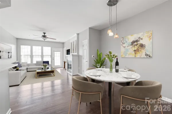 a view of a dining room with furniture window and wooden floor