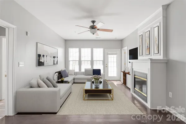 a living room with furniture fireplace and flat screen tv
