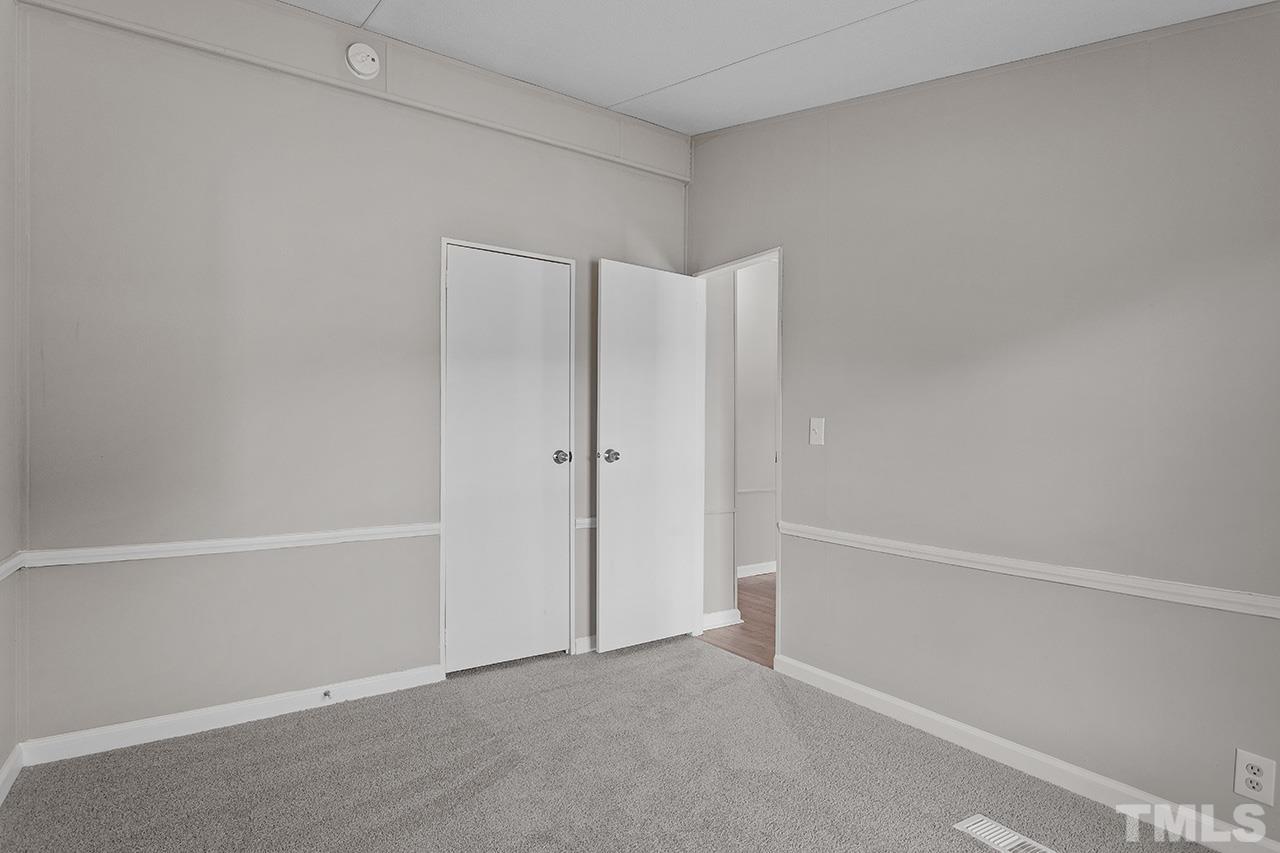 3208 State Road 2750 Willow Spring, NC 27592 - Photo 22 of 32 a view of an empty walk in closet