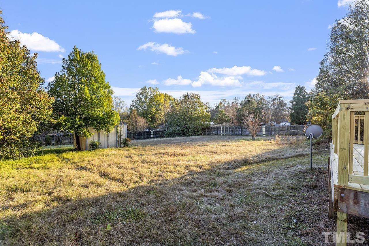 3208 State Road 2750 Willow Spring, NC 27592 - Photo 32 of 32 a view of big yard with large trees