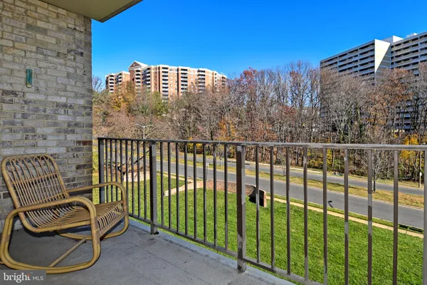 a view of a park with iron fence