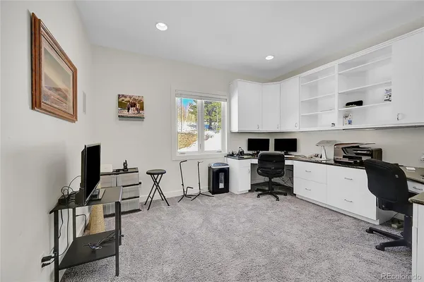 a kitchen with stainless steel appliances granite countertop a sink and a refrigerator