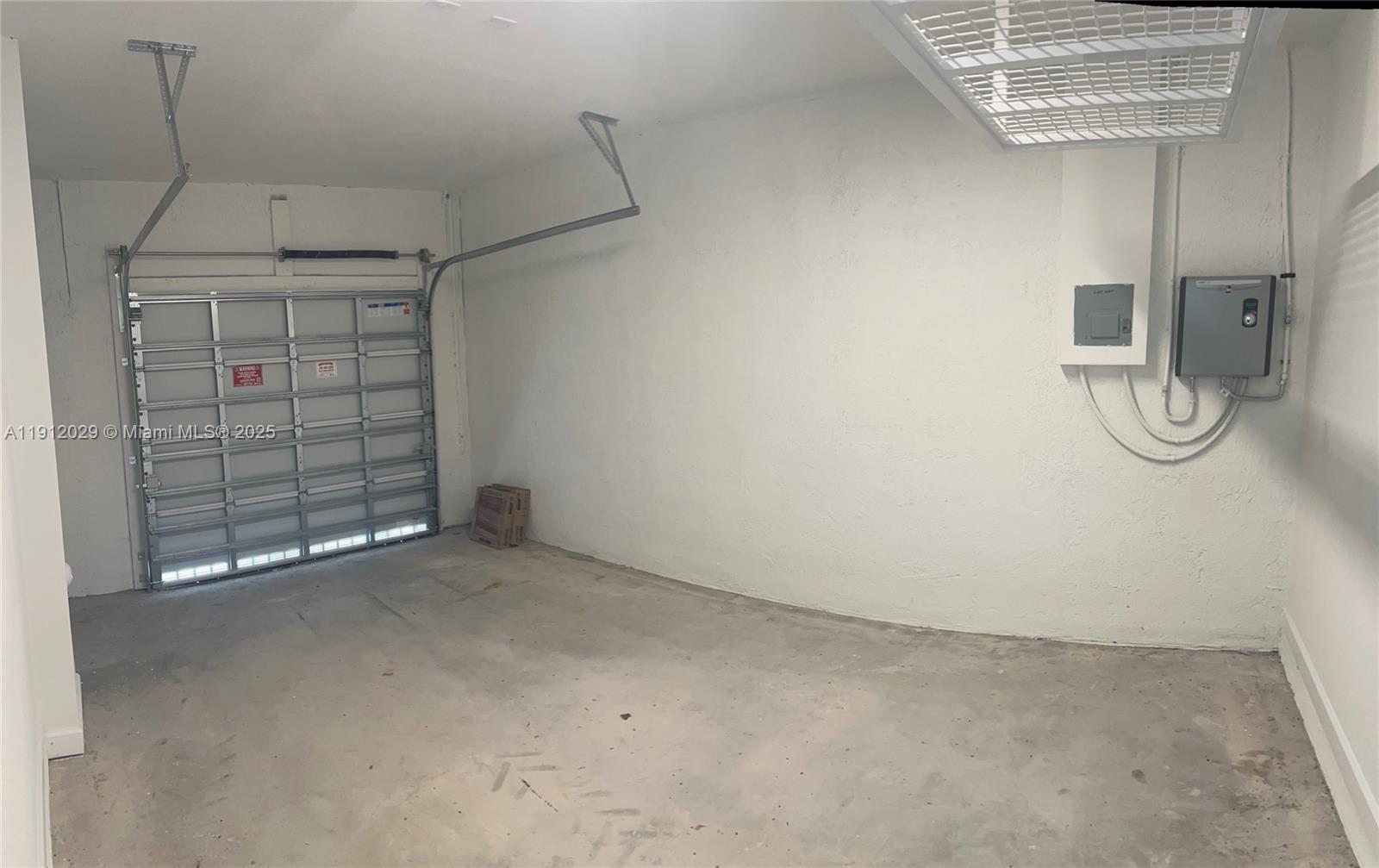 1406 Southeast 6th Road, Unit 1406 Homestead, FL 33034 - Photo 11 of 12 a view of a room with racks on the wall