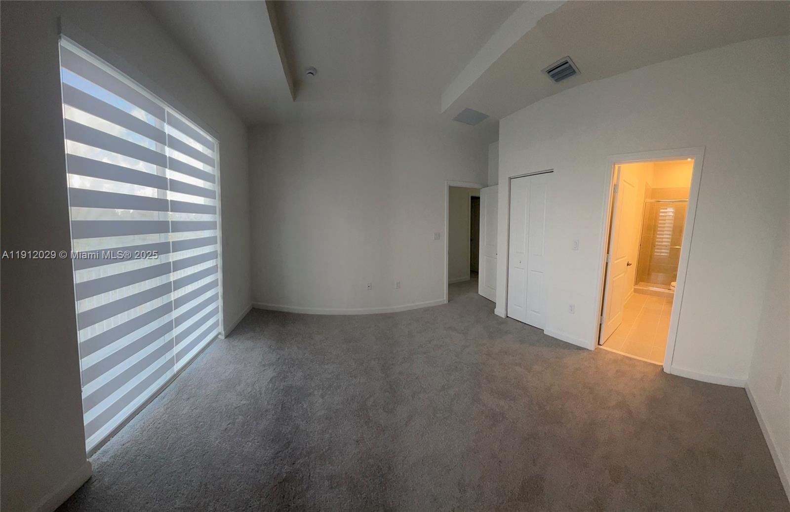 1406 Southeast 6th Road, Unit 1406 Homestead, FL 33034 - Photo 4 of 12 a view of empty room with window and fireplace