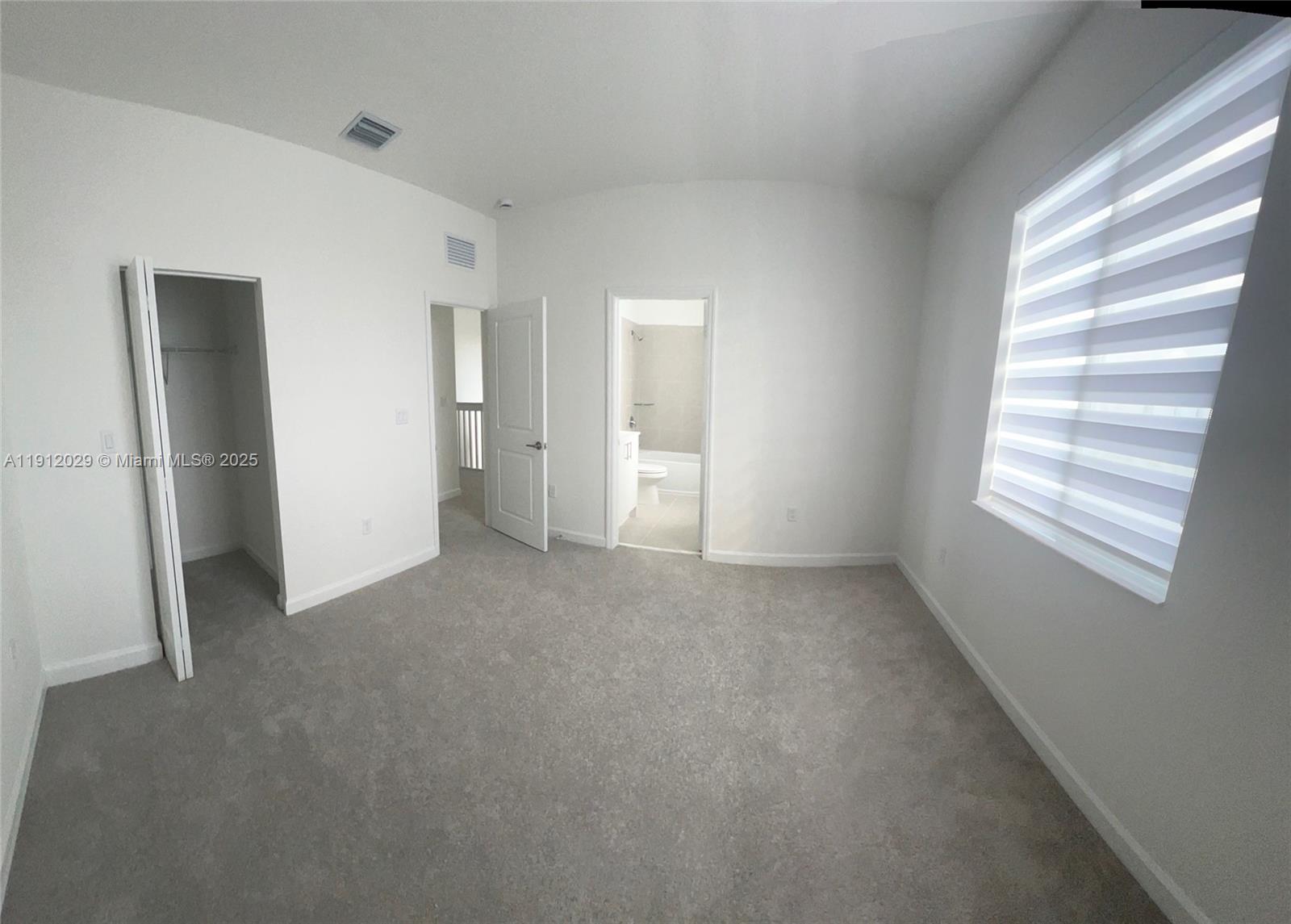 1406 Southeast 6th Road, Unit 1406 Homestead, FL 33034 - Photo 5 of 12 a view of empty room with windows
