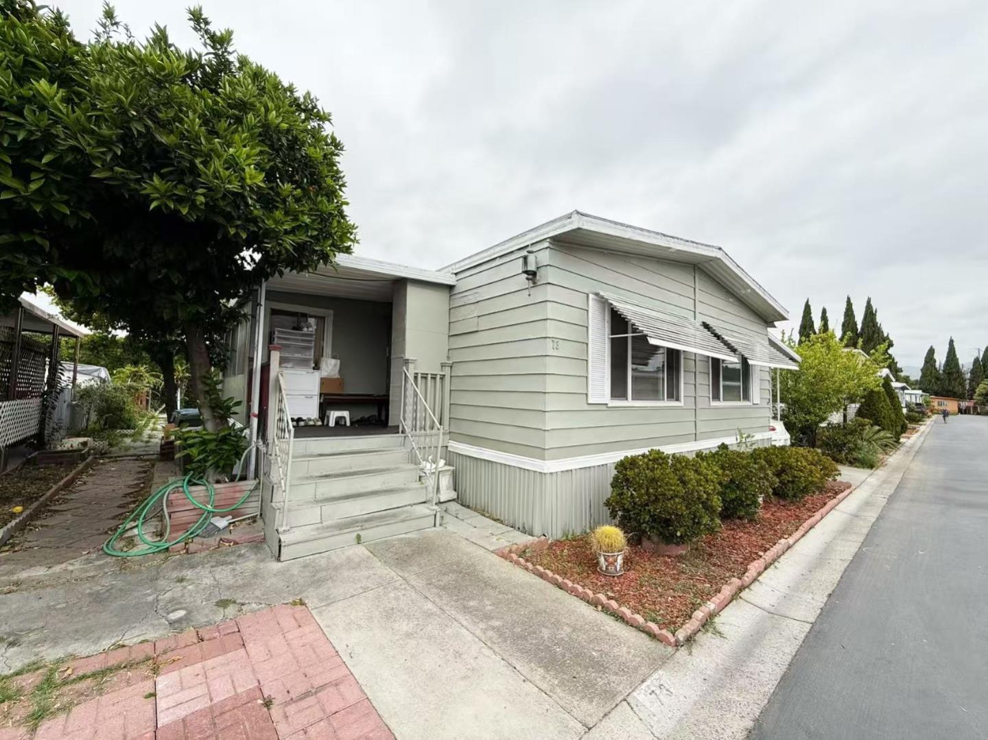 2151 Oakland Road, Unit 73 San Jose, CA 95131 - Photo 3 of 7 a front view of a house with garden