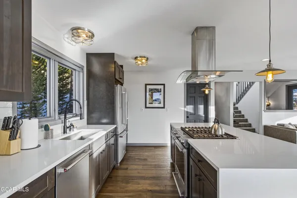 a kitchen with a sink and stove