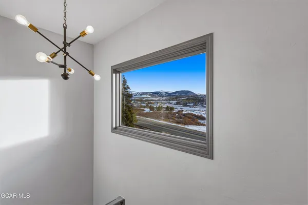 a view of a hallway with a large window