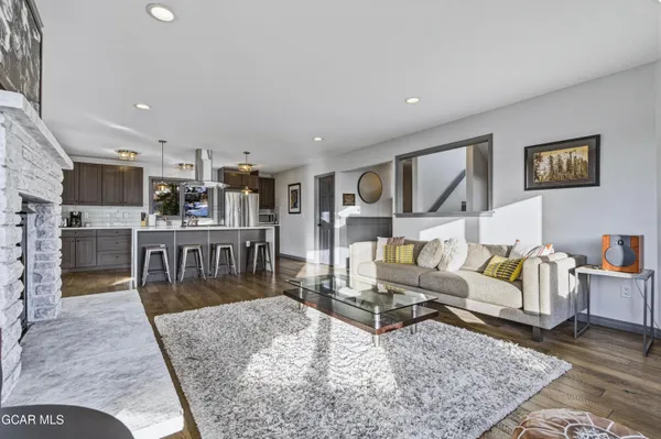 a living room with furniture and a rug