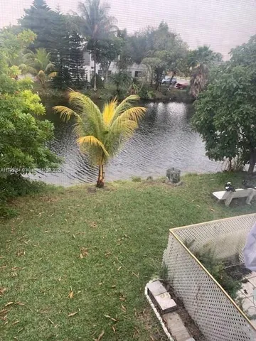 a view of a lake with a yard