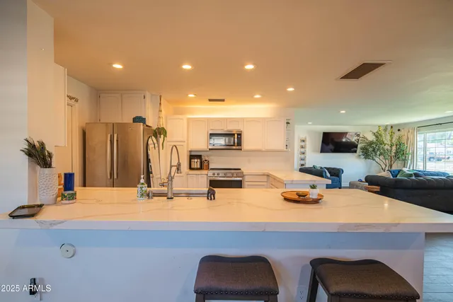a kitchen with a sink stove and cabinets