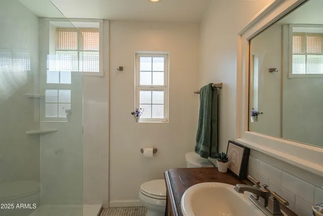 a bedroom with a large bed and a dresser