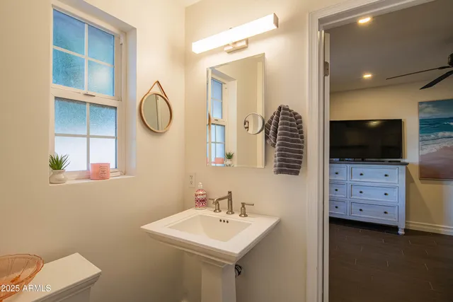 a view of a patio with a table and chairs under an umbrella