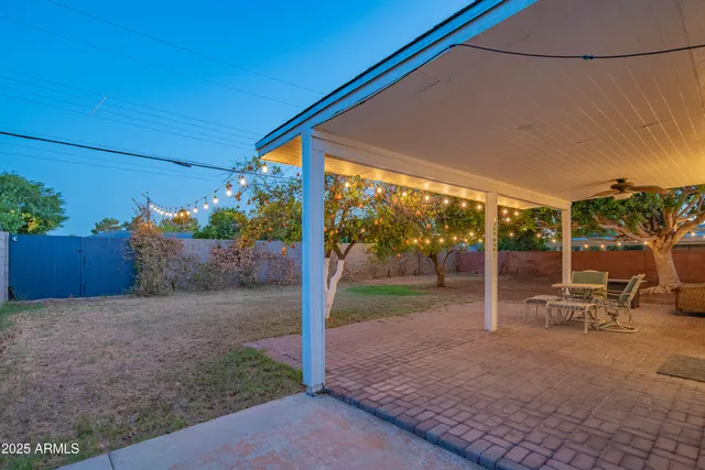 a view of an outdoor dining space with a patio