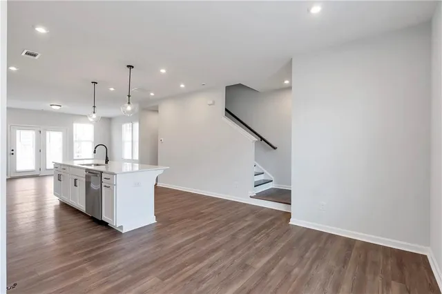a view of kitchen with furniture and wooden floor