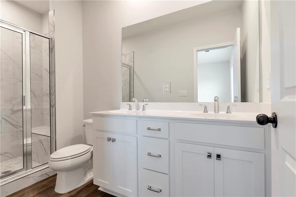 2244 Whistler Way Northeast Lawrenceville, GA 30043 - Photo 17 of 25 a bathroom with a sink toilet and shower