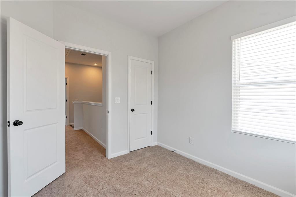 2244 Whistler Way Northeast Lawrenceville, GA 30043 - Photo 22 of 25 an empty room with windows and closet