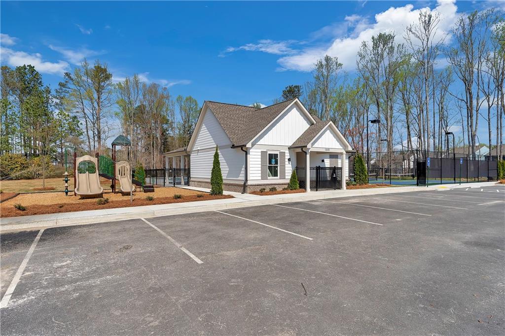 2244 Whistler Way Northeast Lawrenceville, GA 30043 - Photo 23 of 25 a view of a house with a yard and large trees