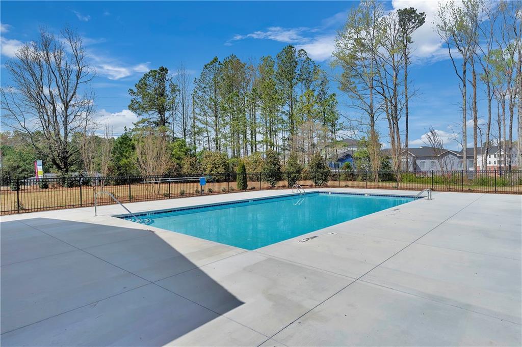 2244 Whistler Way Northeast Lawrenceville, GA 30043 - Photo 25 of 25 a view of yard with swimming pool and trees