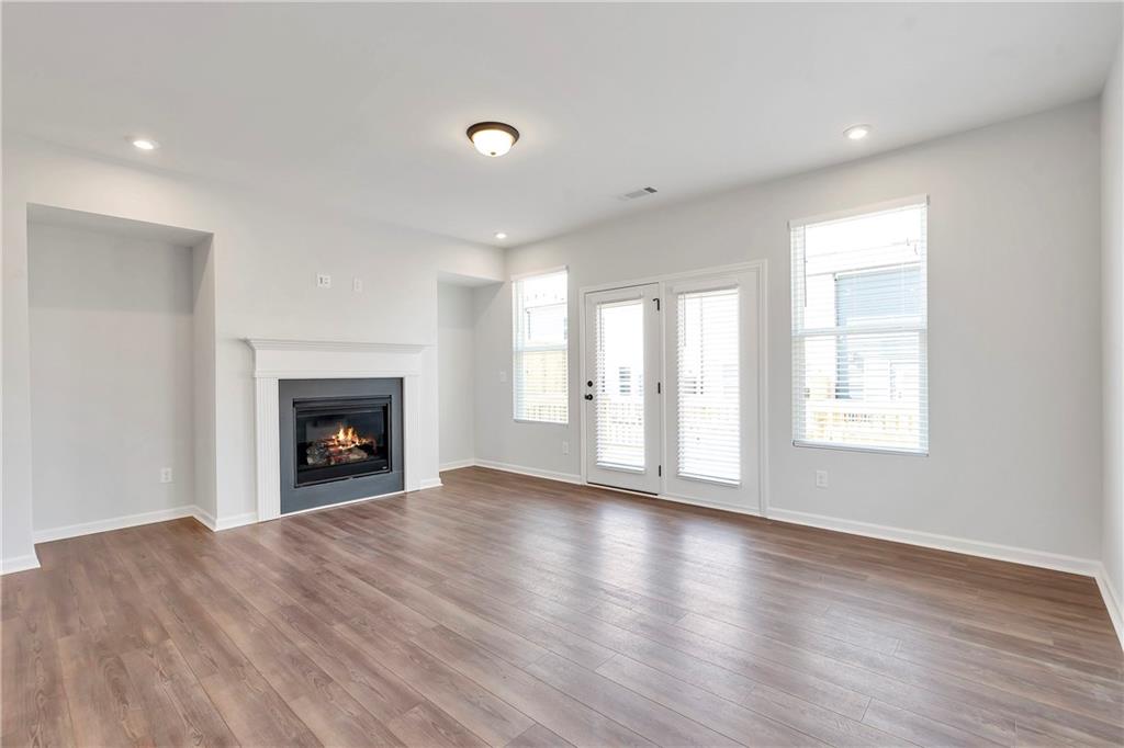 2244 Whistler Way Northeast Lawrenceville, GA 30043 - Photo 7 of 25 a view of an empty room with a window and fireplace
