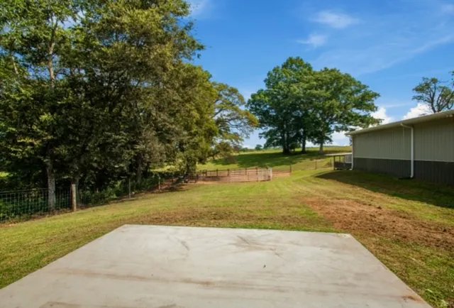 a view of outdoor space with deck and yard
