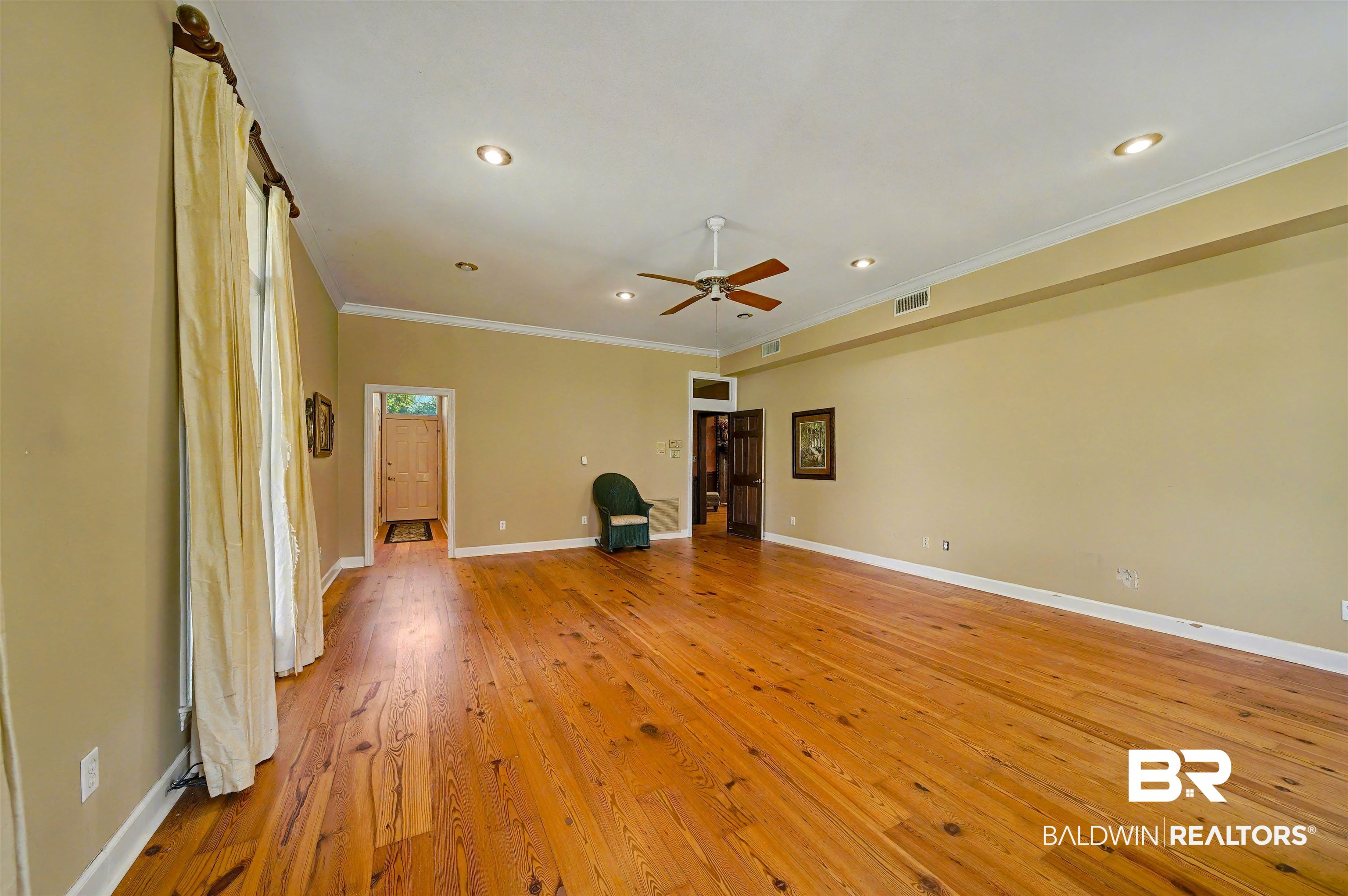 15810 County Road 73 Foley, AL 36535 - Photo 27 of 56 Unfurnished living room with light wood-type flooring, ornamental molding, ceiling fan, and recessed lighting