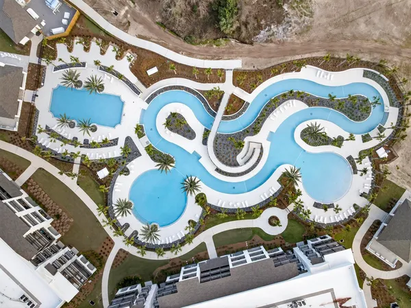 an aerial view of residential houses with outdoor space