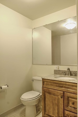 23 Hunt Road Westford, MA 01886 - Photo 17 of 27 a bathroom with a sink a toilet and mirror