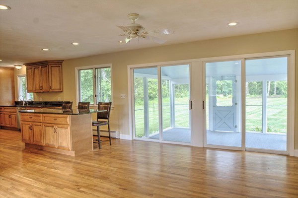 23 Hunt Road Westford, MA 01886 - Photo 3 of 27 a view of kitchen with wooden floor and outdoor space