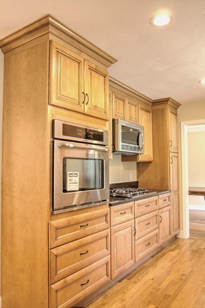 23 Hunt Road Westford, MA 01886 - Photo 7 of 27 a kitchen with granite countertop cabinets stainless steel appliances and counter space