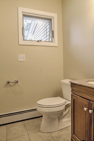 23 Hunt Road Westford, MA 01886 - Photo 8 of 27 a white toilet sitting next to a bathroom sink