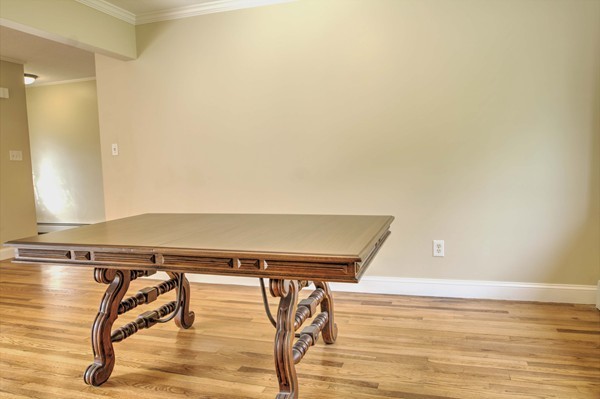 23 Hunt Road Westford, MA 01886 - Photo 9 of 27 a view of a room with wooden floor