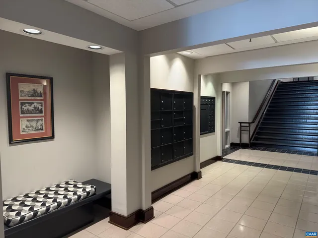 a view of gallery with wooden floor