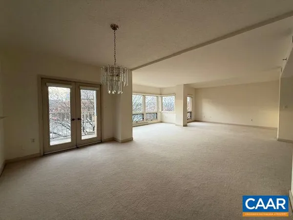 a view of empty room with windows