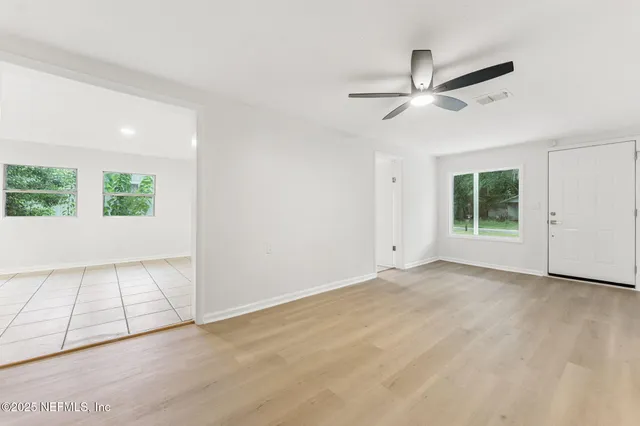 a view of an empty room with a window