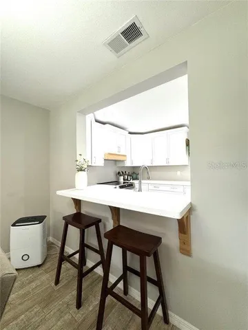 a view of a kitchen with a sink