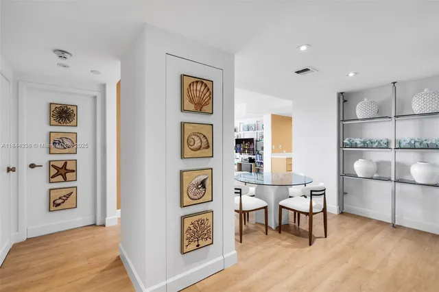 a view of work space with furniture and wooden floor