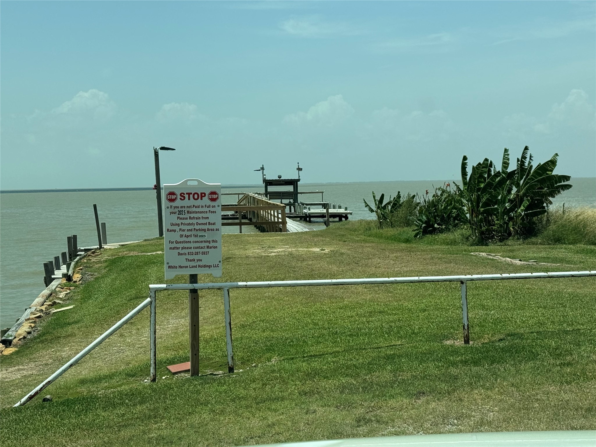 17-5 Mockingbird Lane Anahuac, TX 77514 - Photo 9 of 10 a view of a golf course with a lake