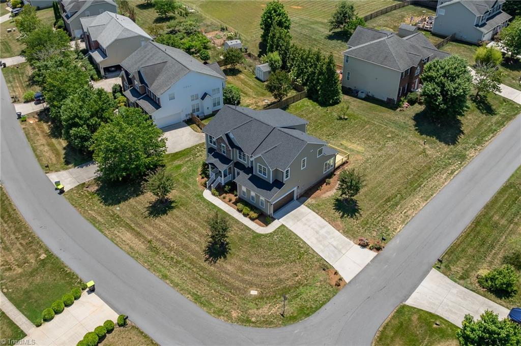 8419 Pheasant Ridge Drive Colfax, NC 27235 - Photo 46 of 49 Bring the World Cup to your own backyard ~ this level yard would be a great space for soccer training!