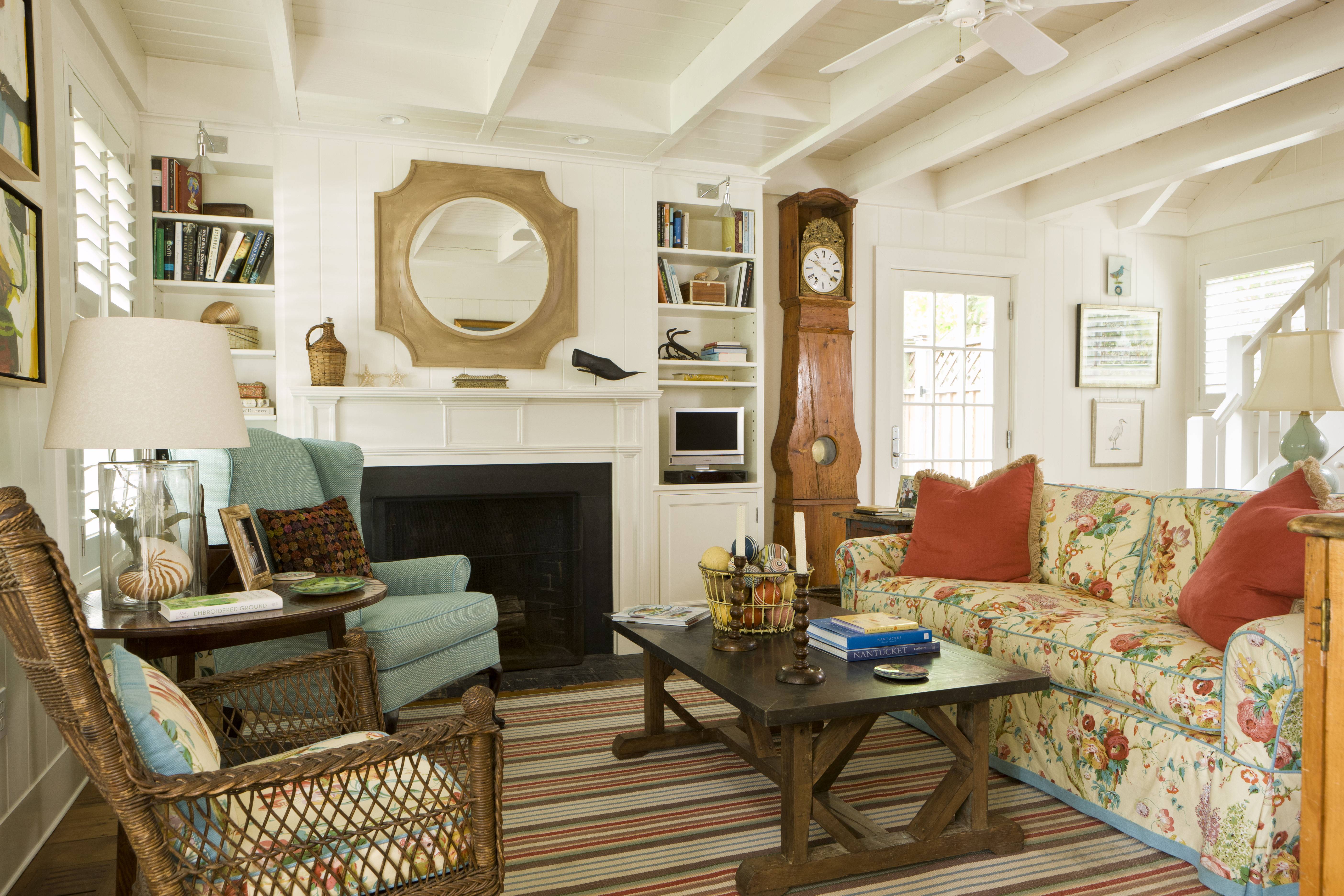 45 Cliff Road Nantucket, MA 02554 - Photo 32 of 36 a living room with furniture a fireplace and a table