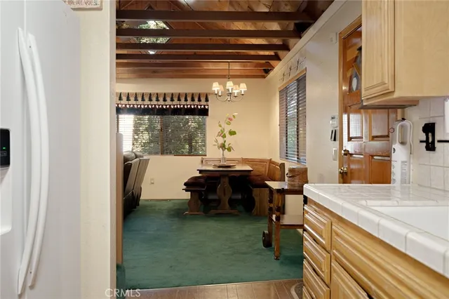 a kitchen with a sink appliances and cabinets