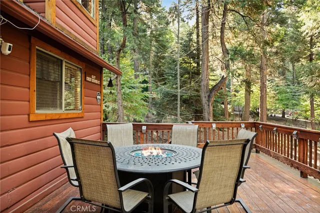 a view of a patio with a table and chairs